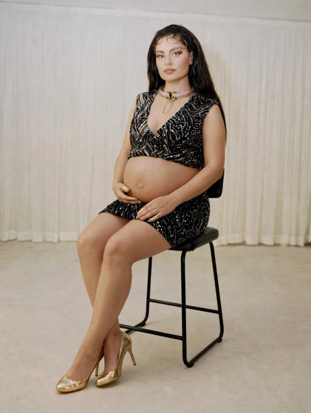 Pregnant woman seated portrait